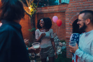 Young People Dancing At Backyard Party